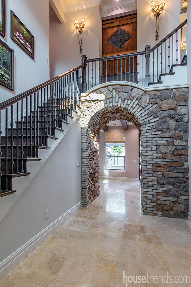 Stone archway ushers guests into a home