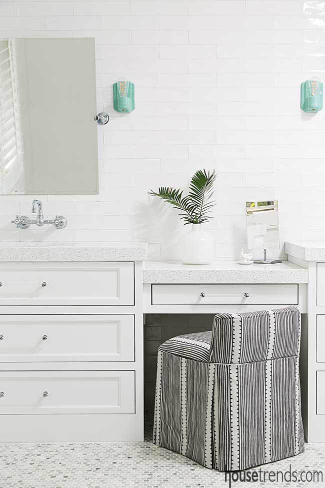 Turquoise lights take the spotlight in a white master bath