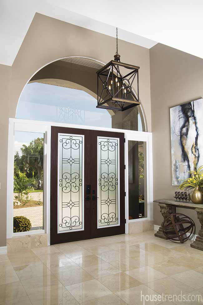 Decorative glass front doors greet guests