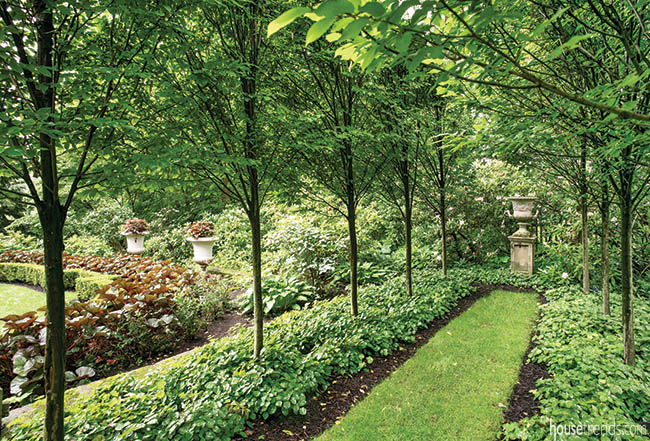 Walking path offers glimpse of an oval garden
