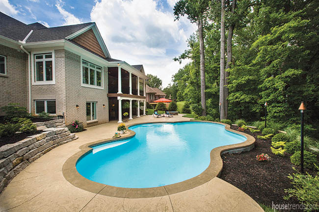 Outdoor entertaining options surround a swimming pool