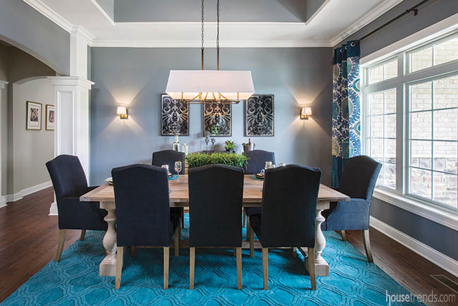 Blue chairs complement a dining room design