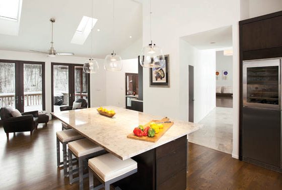 An island topped with a granite countertop provides the perfect place for party prepping
