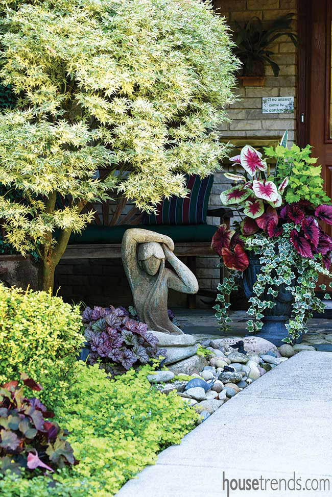 Urn overflowing with colorful plants