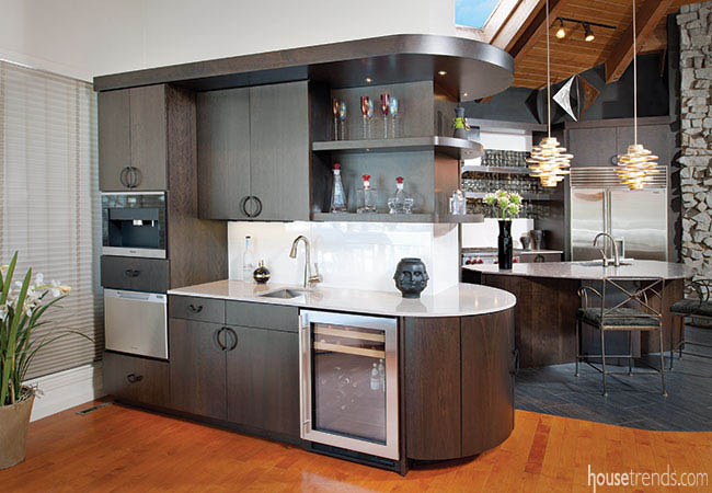 Sleek cabinetry complements a wet bar