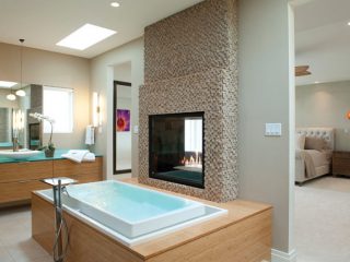 Two-sided fireplaces create a connection with the illusion of privacy