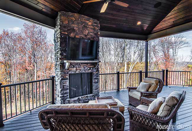 Covered deck with a view of the surrounding landscape