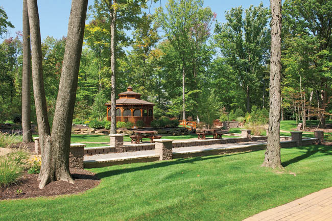 Back yard features entertainment and dining