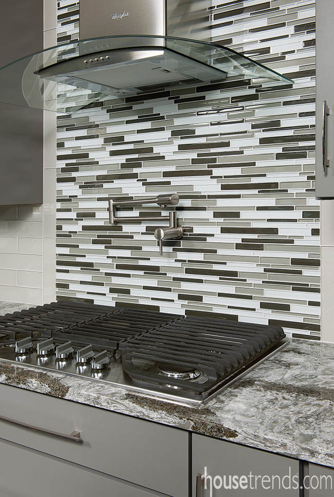 Mosaic tile creates a focal point in a busy kitchen