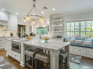 Kitchen island houses bar stools