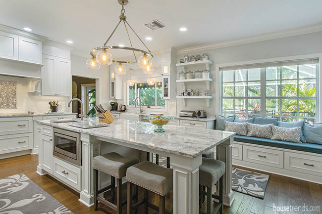 Kitchen island houses bar stools