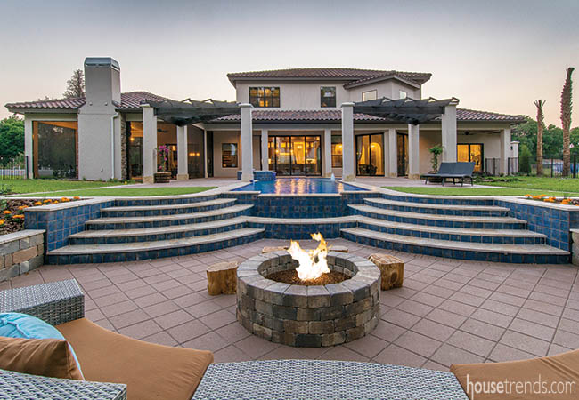 Stairs lead down to a sunken fire pit