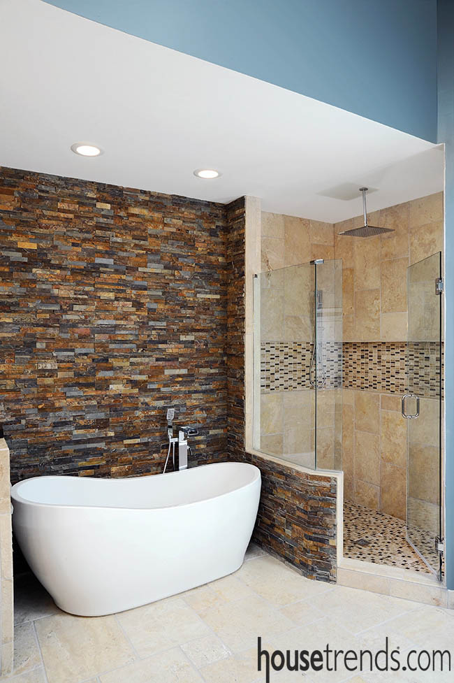 Accent wall spotlights a soaking tub