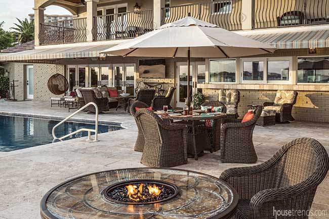 Travertine patio hosts an outdoor seating area