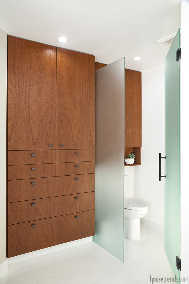 A floating storage cabinet was added to the bathroom remodel.