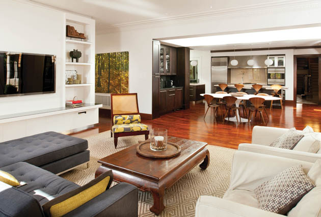 Modern living room layout opens to the kitchen