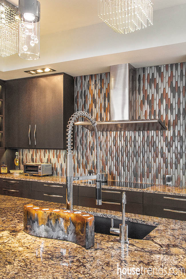 Glass tile backsplash adds interest to a contemporary kitchen