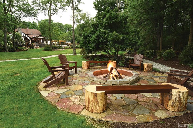 Unique benches surround a fire pit