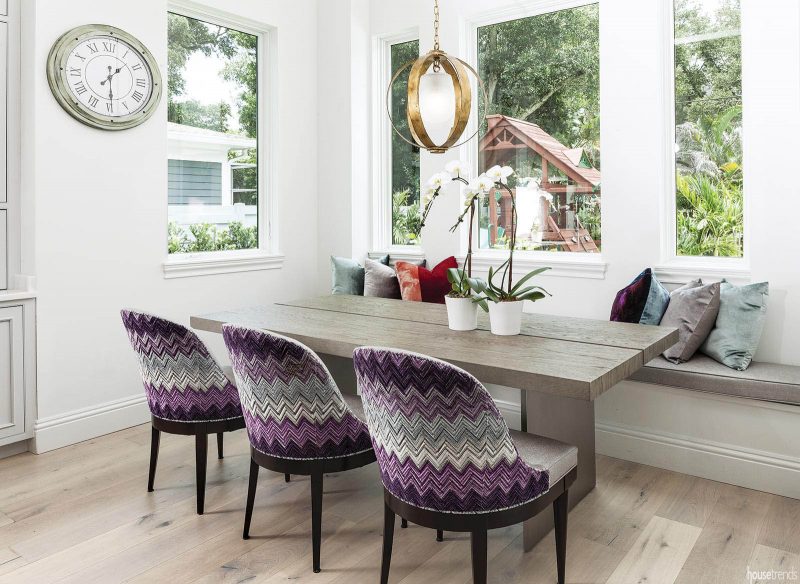 Purple chairs pop in a breakfast nook