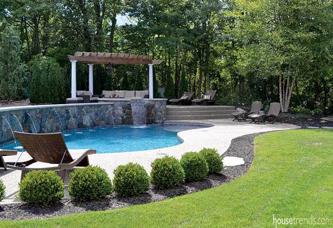 Cedar pergola overlooks a swimming pool