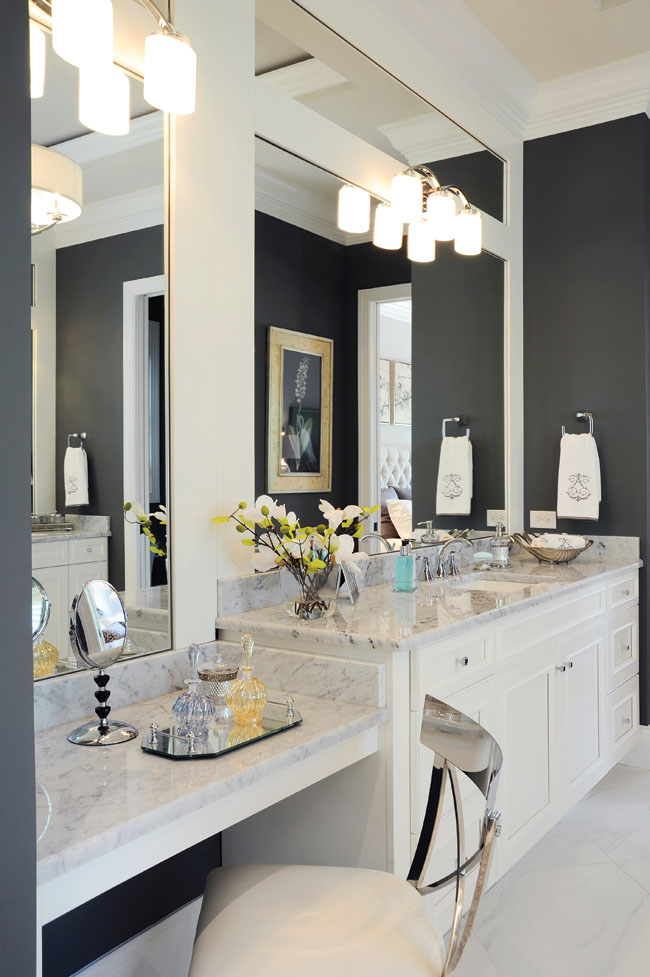 Bathroom mirrors highlight the ceiling's soaring height