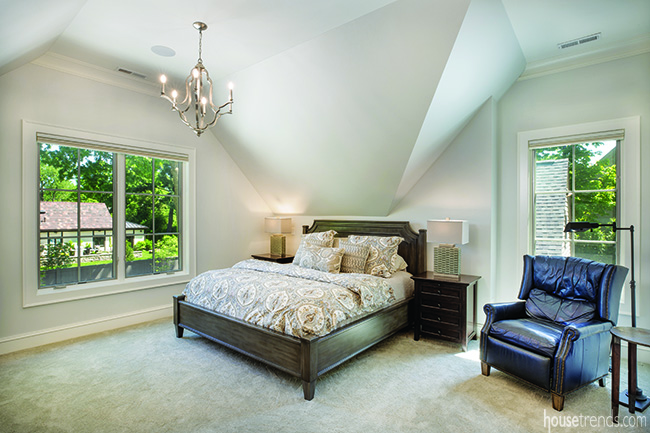 Master bedroom is built into the corner of a second level addition.