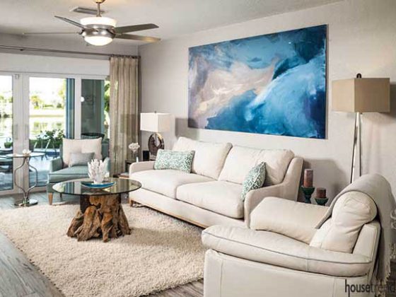 Blue wall art pops in a living room
