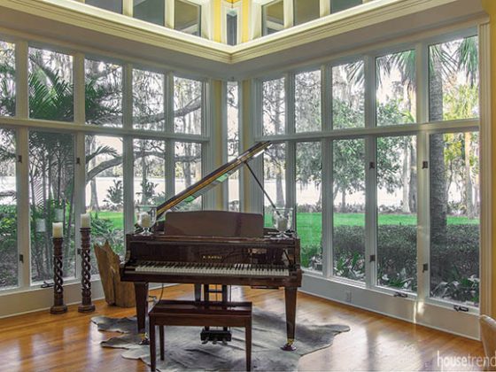 Piano tucked into a glass corner