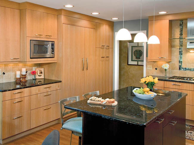 Kitchen cabinetry conceals a refrigerator