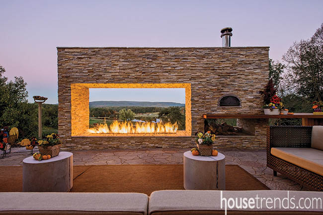 Outdoor fireplace highlights the view