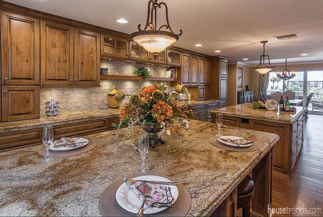 Stone backsplash flatters granite countertops