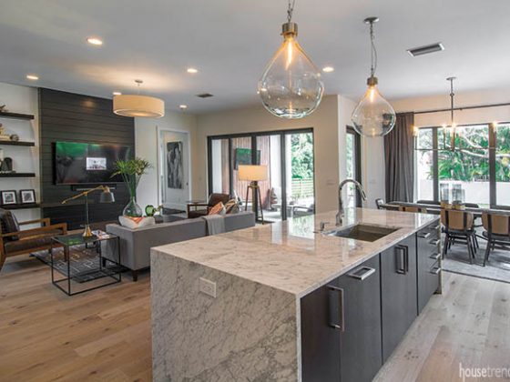 Glass chandeliers shine on a kitchen island