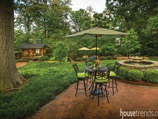 Table and outdoor bar stools create intimate seating area