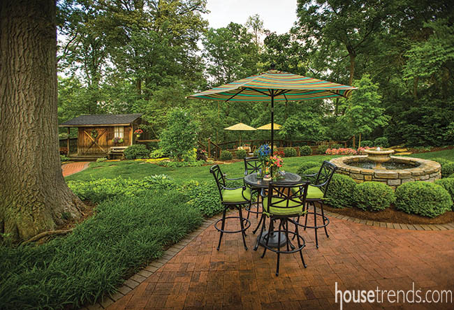 Table and outdoor bar stools create intimate seating area
