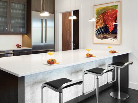 Wall art is the only color in a kitchen