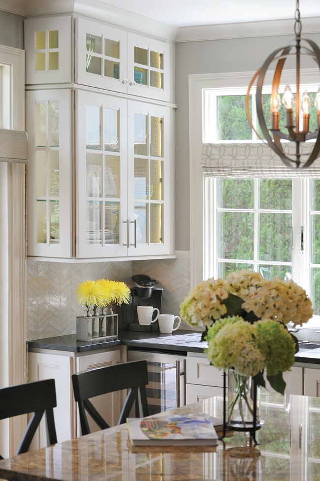 Display cabinets add interest and color to the kitchen