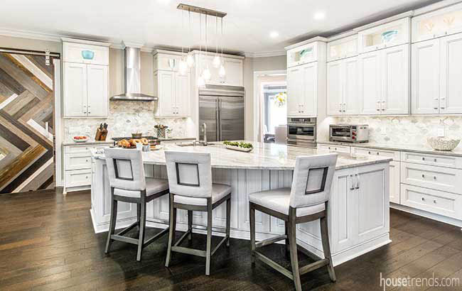Sliding barn door hides a mudroom