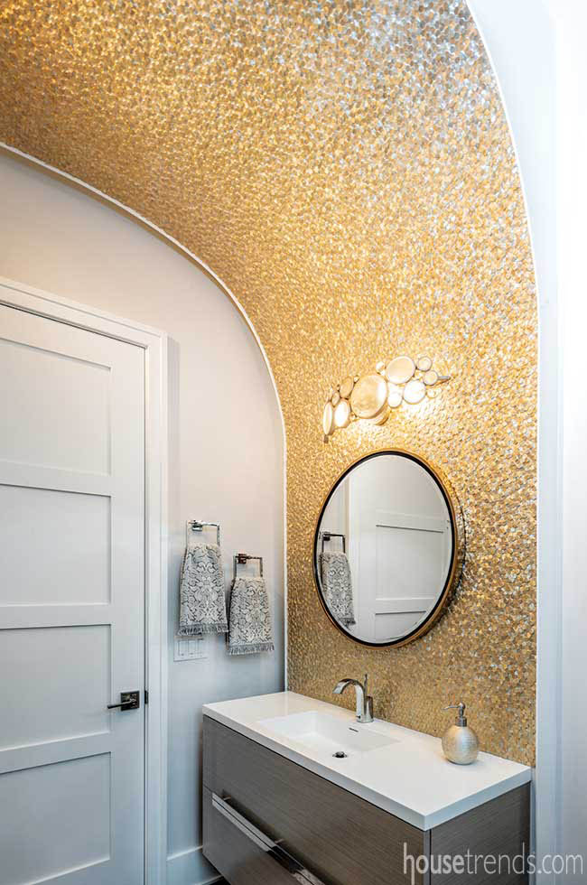 Gold tile dazzles in a powder room