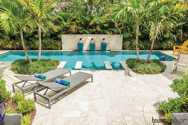 Lap pool runs through a back yard