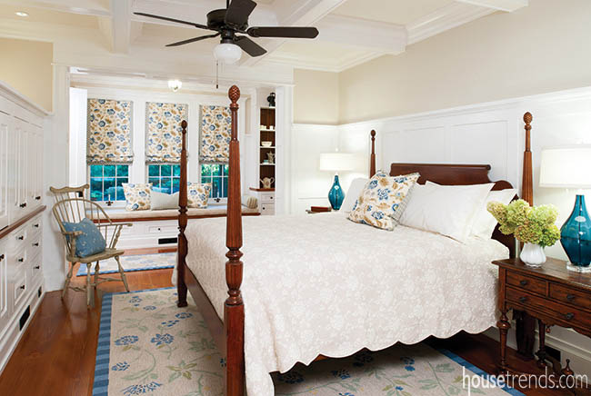 Poster bed dominates a master bedroom design