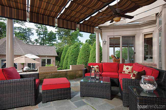 Plush red cushions soften outdoor furniture