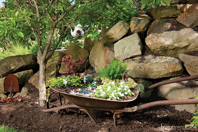 Fairy garden accessories add whimsy to a back yard