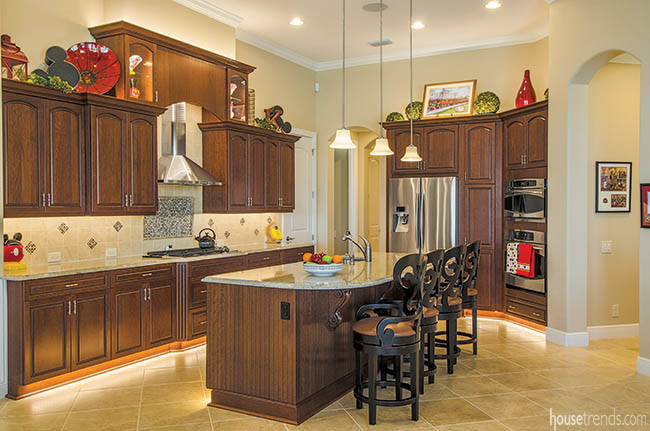 Lighting lends a dramatic flair to the kitchen