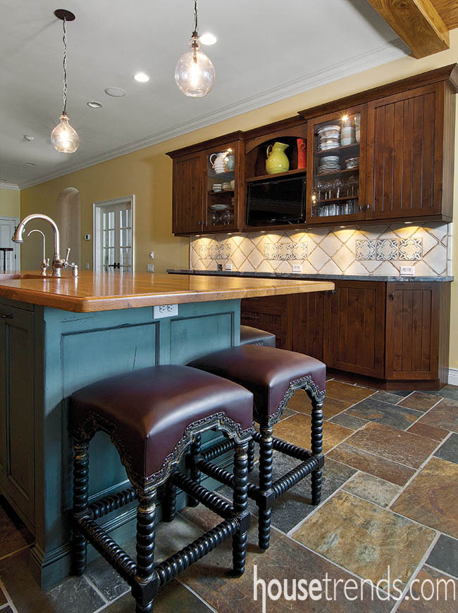 Kitchen cabinetry houses a television