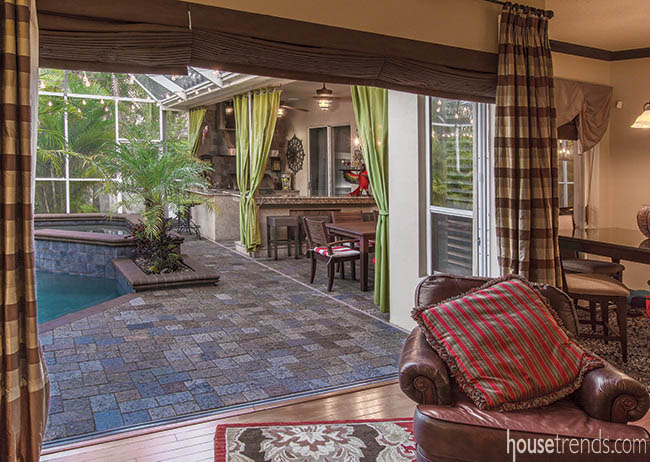 Living room opens into a patio
