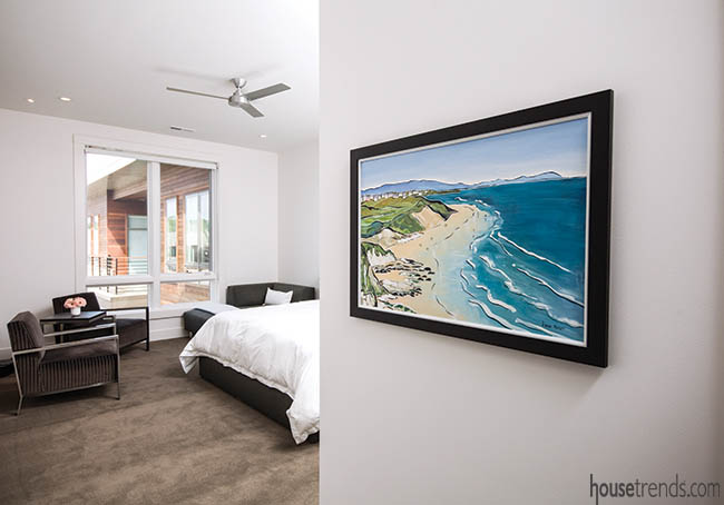 Painting pops against a white bedroom wall