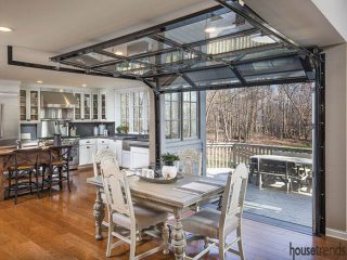 Glass garage door leads to a deck