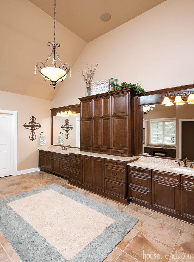 Cabinets offer separation in a master bathroom