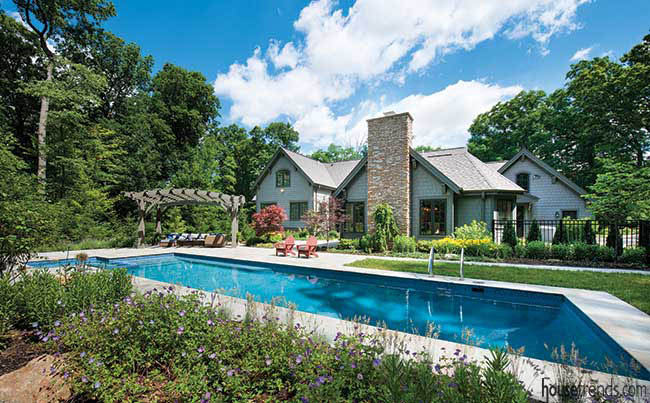 Pool spreads across a back yard