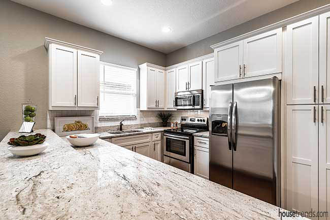 Granite countertops complement the kitchen